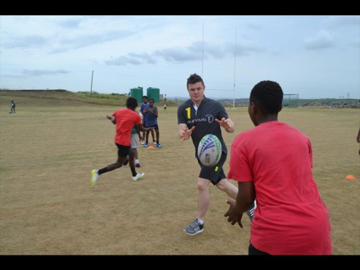 Brian O'Driscoll made time during his tour of LIV Village to join in on some rugby drills.
