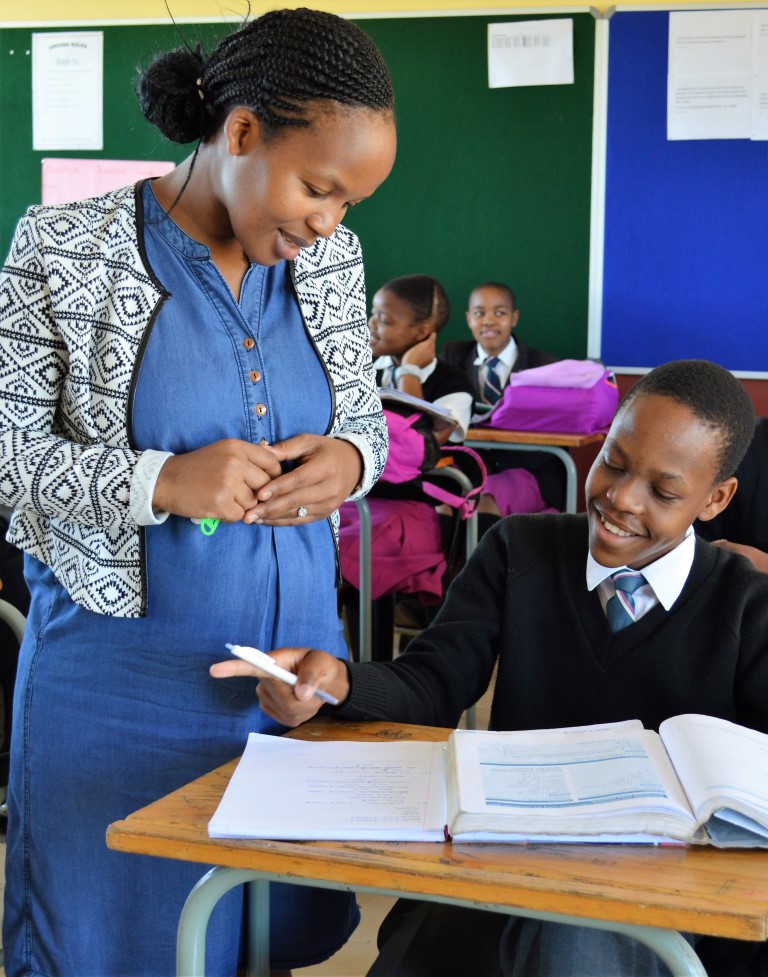 Gumede Nzuzo gets some tips from teacher Nombuso Nzimande