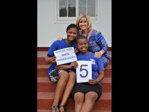 Marion Takis with two of the top achievers at Protec, Sinehlanhla Mavundla with three distinctions and Sinethemba Dlamini with five.