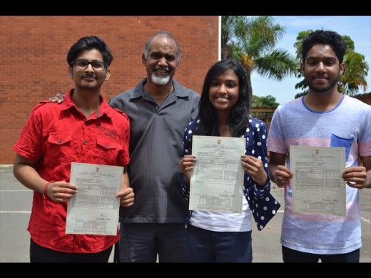 Proud principal Kola Govender with three of Seatides Combined schools top performing pupils, Kylen Dilsook, Meleshnie Govender and Ruwayne Ivasen.
