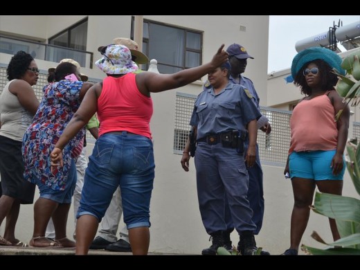 Visitors having an argument with police and the the UIP security guards on December 16 at Clarke Bay.