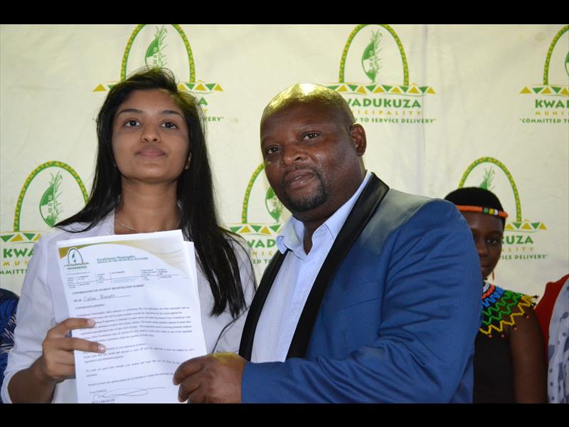 Celine Bisnath happy to receieve her student funding from KDM mayor Ricardo Mthembu.