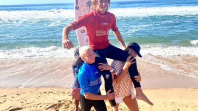 Ryan Kainalo being carried out of the water