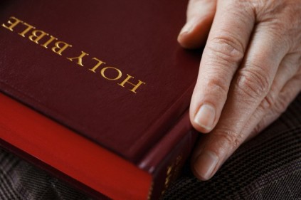 Senior woman holding bible