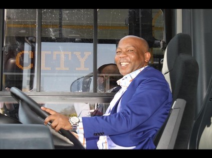 Executive Mayor Kosientso Ramokgopa in a brand new bus.