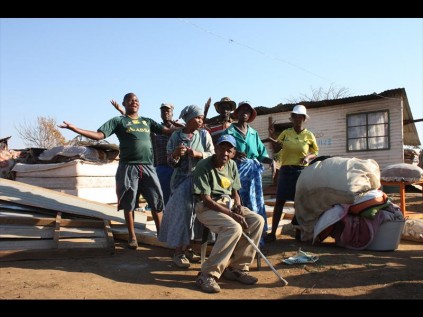 Residents of Mamelodi East, Extension 11 next to their demolished shacks.