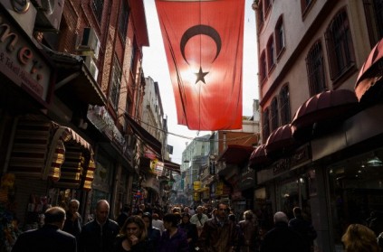 People in a street near the Spice Market