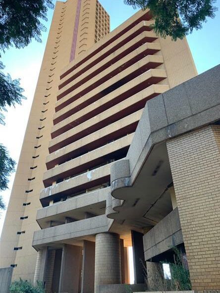 Eradicate Tshwane hostels and create plan to leverage CBD abandoned buildings