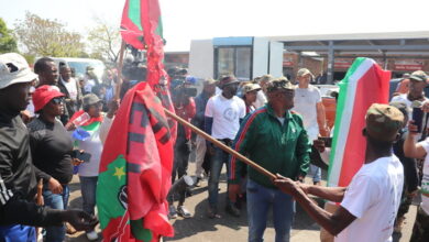 Operation Dudula members burning EFF flags. Photo: Manna Maurice