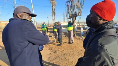 Police advising commuters about the importance of road and rail safety.