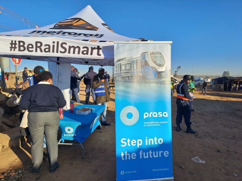 Police advising commuters about the importance of road and rail safety.