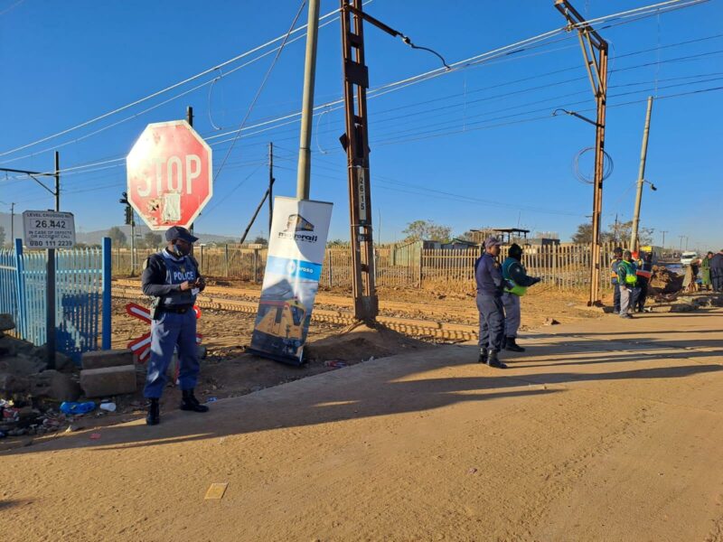 Police advising commuters about the importance of road and rail safety. Police advising commuters about the importance of road and rail safety.