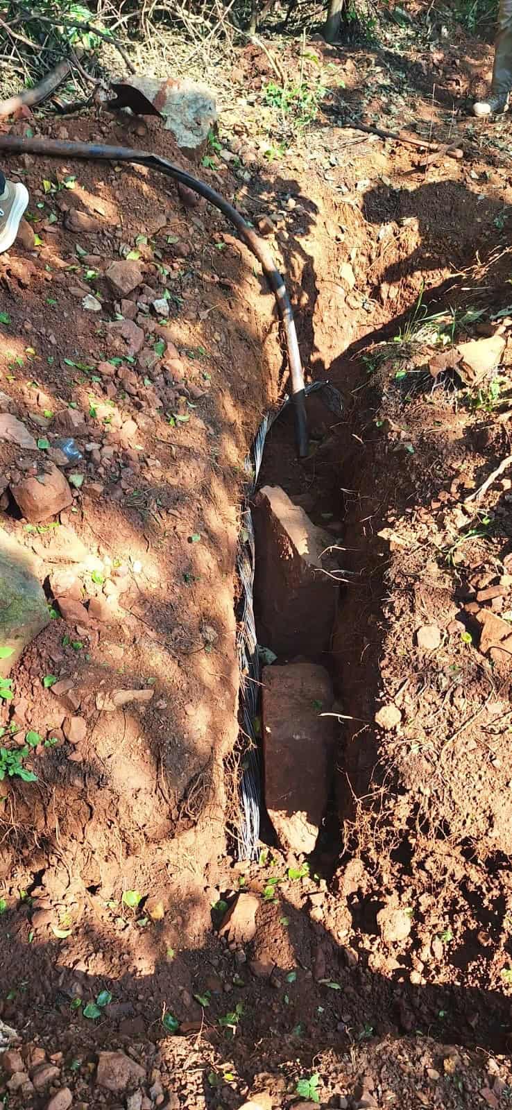 An open trench with cut cables. Photo: Supplied/Bull Security