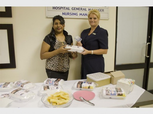 Merisha Gopichund sells food to Gertruida Havenga to raise funds for children.
