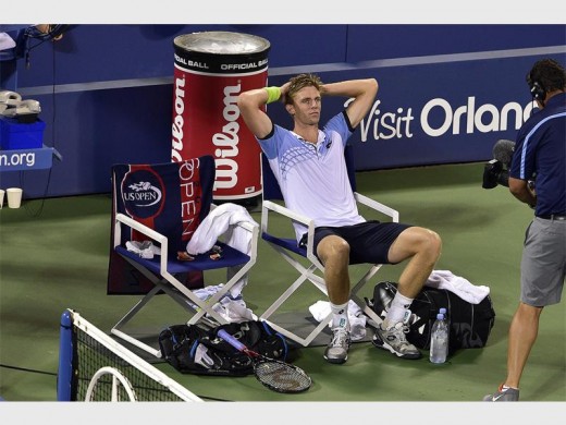 Kevin Anderson reacts after beating Andy Murray in a men's singles fourth-round match during the 2015 US Open. Photo (USTA/Steve Ryan)