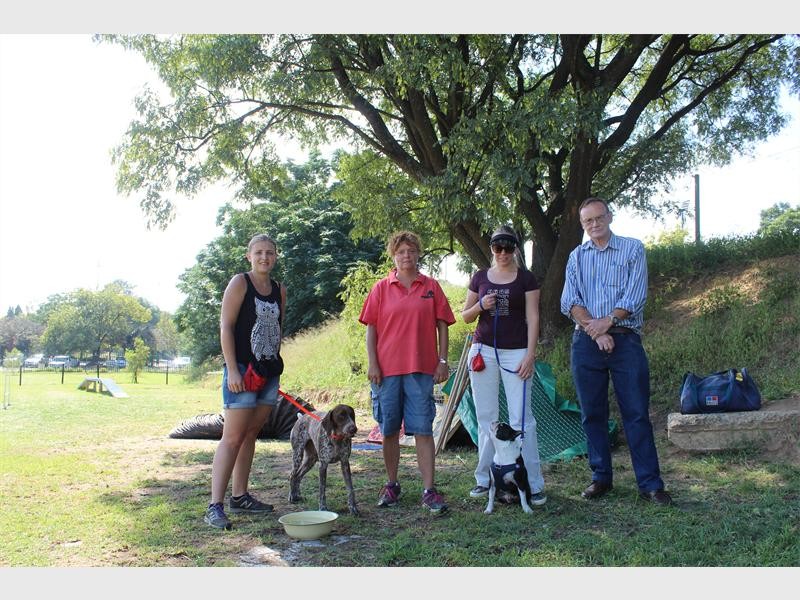 Tracey Mulder, Heidi Olivier (dog trainer), Alexander Hovelmeier and Ward 104 Councillor Mike Wood at the Academy with the trained dogs.