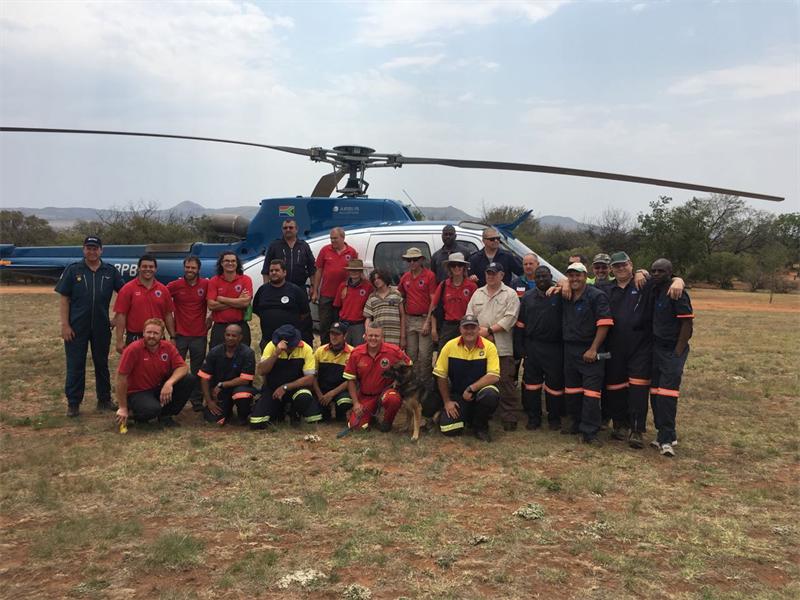 Tristan (middle) with the rescue team.
