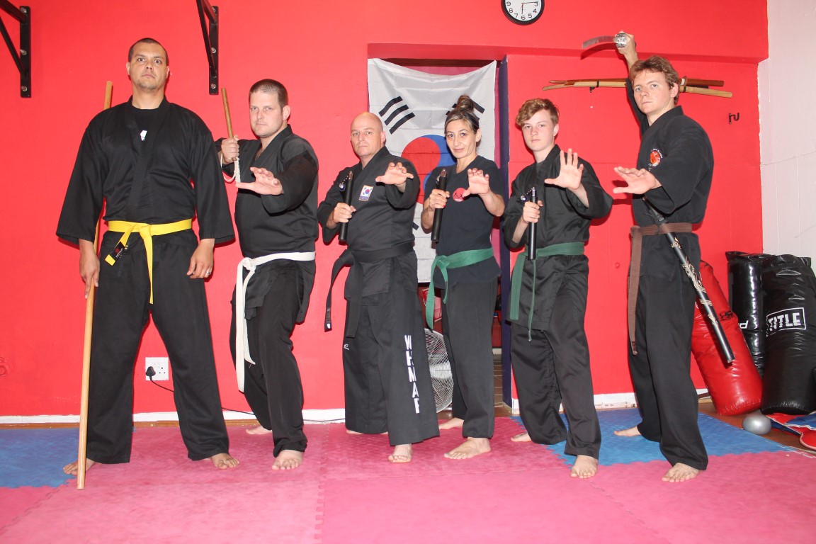 Donovan White, Danneel Whitfield, Philip Wadsworth (instructor), Kelly Dairopoulos, Keenan Louw, and Travis Herbé practice hapkido at Fitness Warriors.
