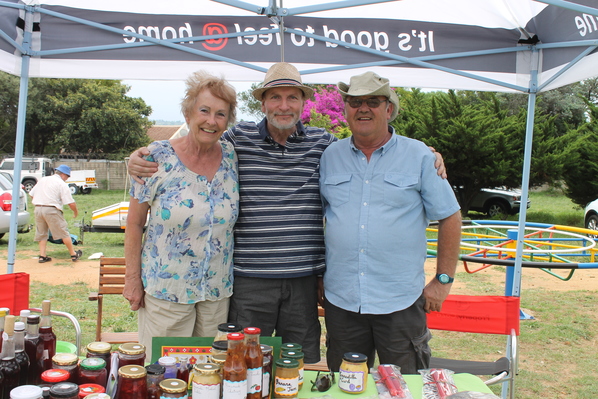 Reiny Maher, George Bahr and Chris Murphey enjoy the market while they run their preserves and jam stall.