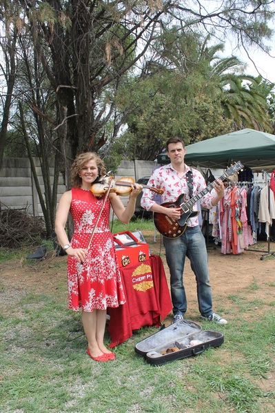 Kristel Birkholtz and Rory Gaddin of the Cherry Pill band entertain the crowds at the market.