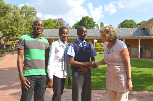 Proud parents Charles Kamanga and Phephani Malotsane watch as David Kamanga is congratulated by Heather Frankiskos, deputy head St Stithians Boys' College, on being awarded the Thandulwazi-FEM Academic Scholarship. Photo: Supplied.