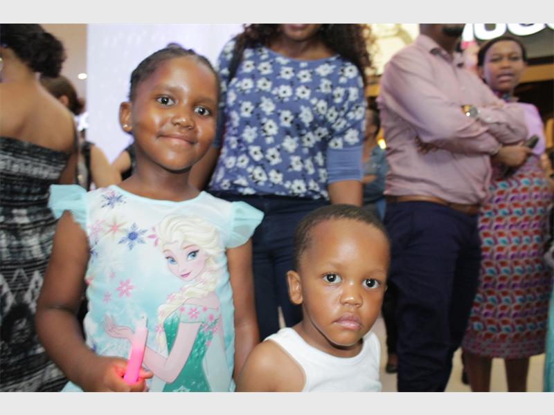 Mandisa and her younger brother, Andile Ncube are excited to sing carols.