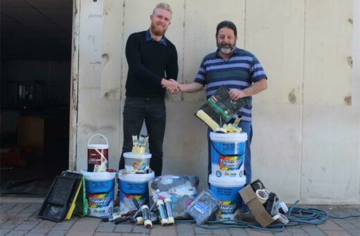 Dwayne Reinecke from Universal Paints is happy to donate the paint and supplies to Honeydew CPF's Jon Rosenberg.