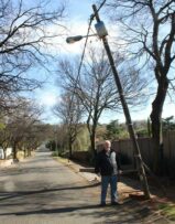 Harold Fleishman under the skew streetlight pole on 36 Neilson Drive. Photo: Mthulisi Lwazi Khuboni