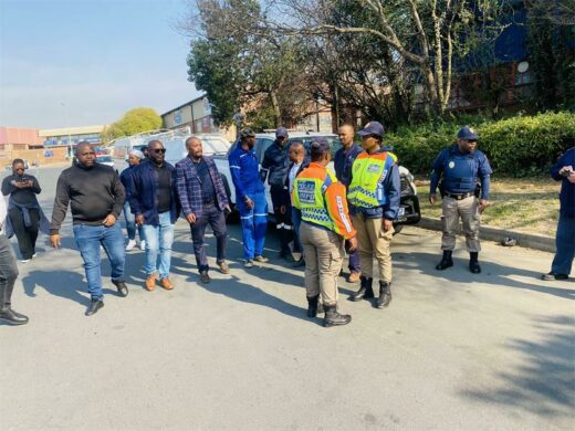 Johannesburg Metropolitan Police Department officials escort City Powers officials to conduct the operation. Photo: Simon Majadibodu