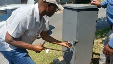 City Powers power quality assurance officer Bongani Sibeko, locks an electricity box in Sundowner.