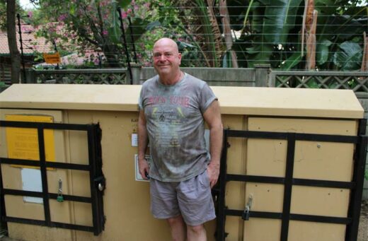 David Strachan stands in front of the electricity box that he closed with the help of people in his street.