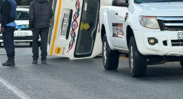 A taxi has just overturned on Kelly Ave at the Barn Church.