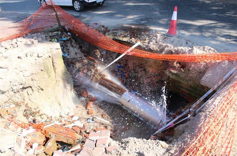 The Nerina Street pipe burst continues to spray out water, causing further damage to the road.