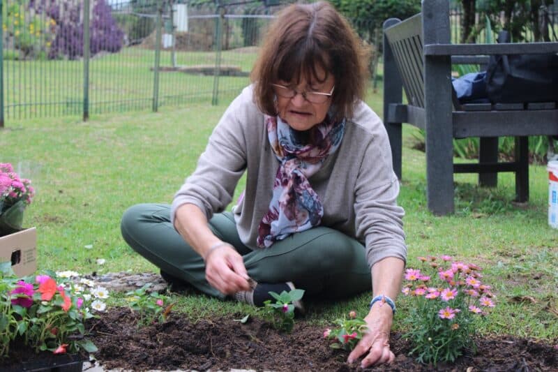 Garden Village residents marked Cancer Awareness Month by planting trees and flowers in a Garden of Remembrance to honour survivors, fighters, and loved ones lost.