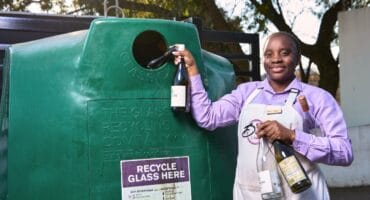 Stock image of a person recycling glass bottles as part of The Glass Recycling Company (TGRC) #GlassRecyclingChallenge 2025. Photo: Provide