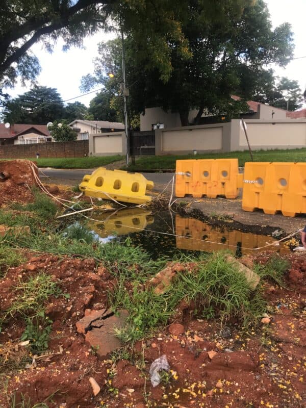 Johannesburg Water has not backfilled the road in Blairgowrie for months, and the hole is now filled with water and litter.