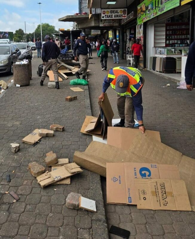 JMPD officers move through Bram Fischer Drive during the by-law enforcement operation in Randburg on December 4, 2025. Photo: Supplied