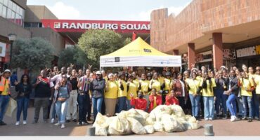 Shincheonji Volunteers, the outreach arm of the Shincheonji Church of Jesus, pose for a photo after their clean-up at the Randburg CBD. Photo: Nkazimulo Ncube