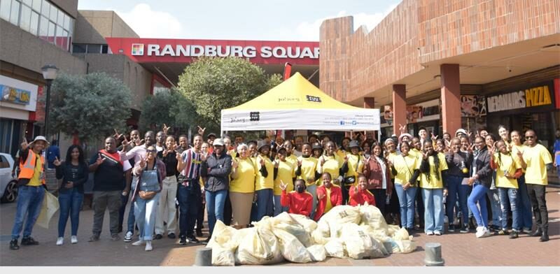 Shincheonji Volunteers, the outreach arm of the Shincheonji Church of Jesus, pose for a photo after their clean-up at the Randburg CBD. Photo: Nkazimulo Ncube
