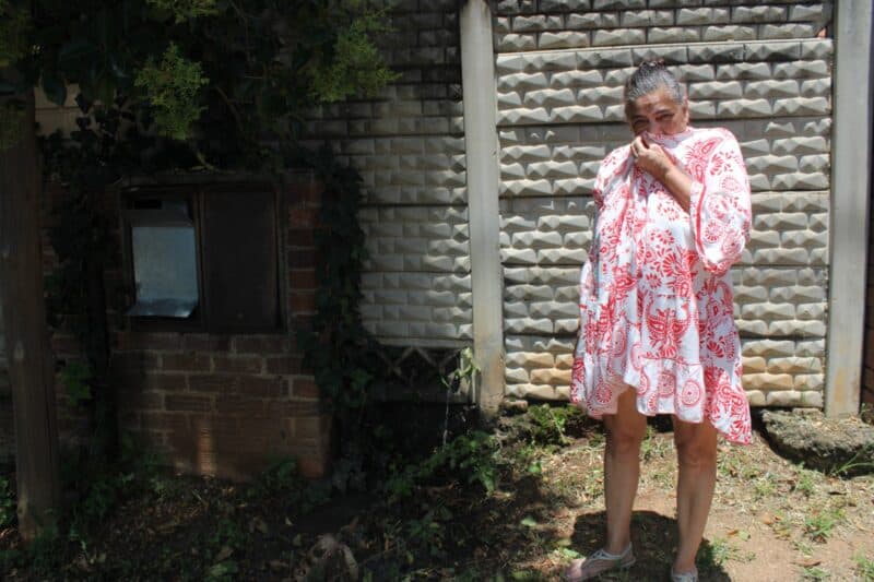 Bernadette Fischer battles the unbearable stench as sewage continues to pump out of the manhole on her property in Kensington B.