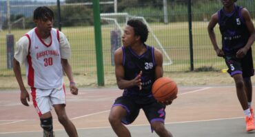 Wild Dogs' Handsome Vazi looks to make a play under pressure from King Solomon Basketball Academy's Leago Mothupi during their friendly match at Randburg Sports Complex. Photo: Nkazimulo Ncube