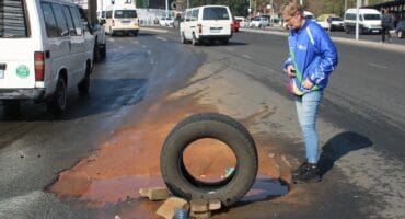 Ward 102 councillor Bea Campbell-Cloete is frustrated by a pipe burst on Bram Fischer Drive. Photo: Mthulisi Lwazi Khuboni