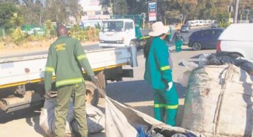 City entities work together to clean the green belt on the CR Swart Drive bridge. Photo: Supplied
