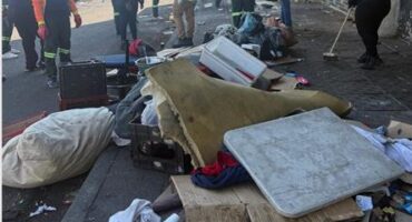 Crum officers clean up the streets in Randburg's central square as part of an intensified clean-up operation led by Crum Region B.Photo: Supplied