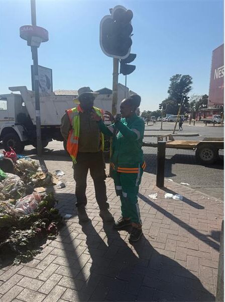 DESCRIPTION: Crum Region B director Sello Lemao and Deputy Mayor Loyiso Masuku during clean-up operations in Randburg's CBD targeting illegal trading, illegal parking, and littering around the area's central square. Photo: Supplied