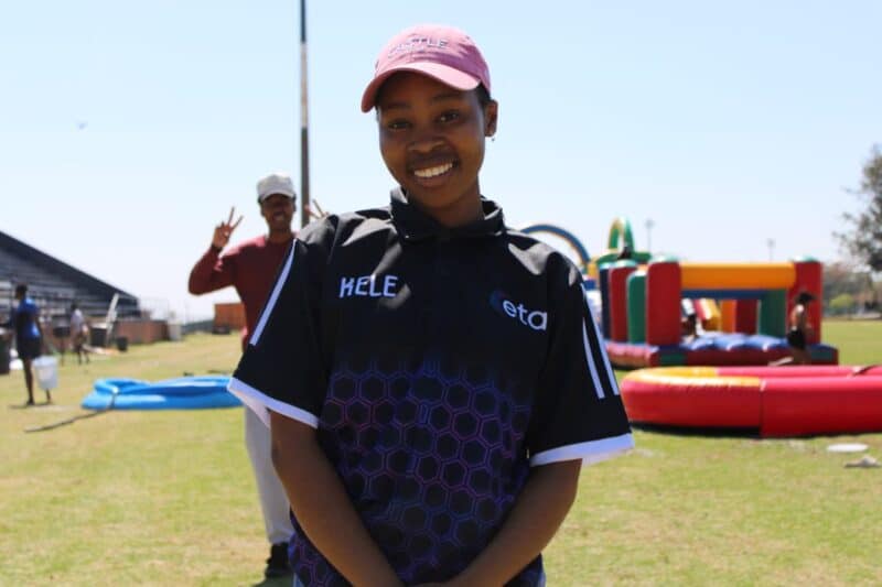 SRC member Kelebogile Seopa poses at the ETA College spring day, with colourful inflatable structures in the background. Photo: Nkazimulo Ncube