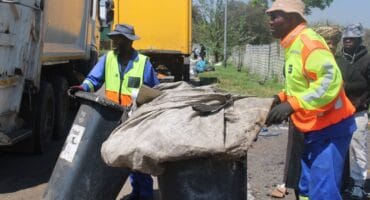 Pikitup workers under the CR Swart Drive bridge. Photo: Mthulisi Lwazi Khuboni