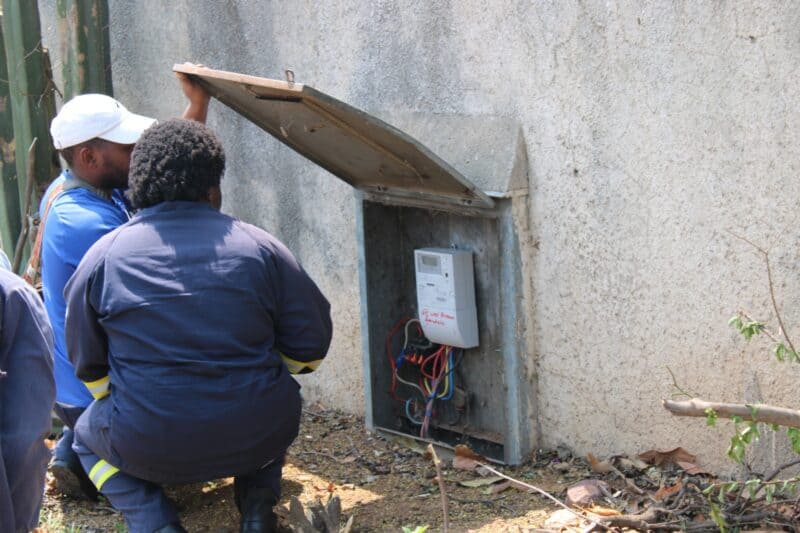 City Power officials check the wiring and metering of an electricity connection at a property in Ferndale, one of several checks carried out during the September 17 multi-agency operation in Ward 102. Photo: Nkazimulo Ncube