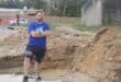 Ward 134 councillor Devon Steenkamp on Puttick Avenue that is currently closed as contractors dug up the road to fix the pipe. Photo: Mthulisi Lwazi Khuboni