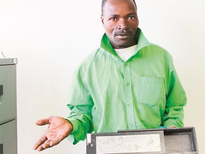 Mandla Mbotom with the empty money box.